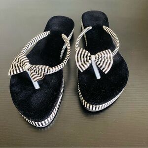 Black and white slippers. Size 8.